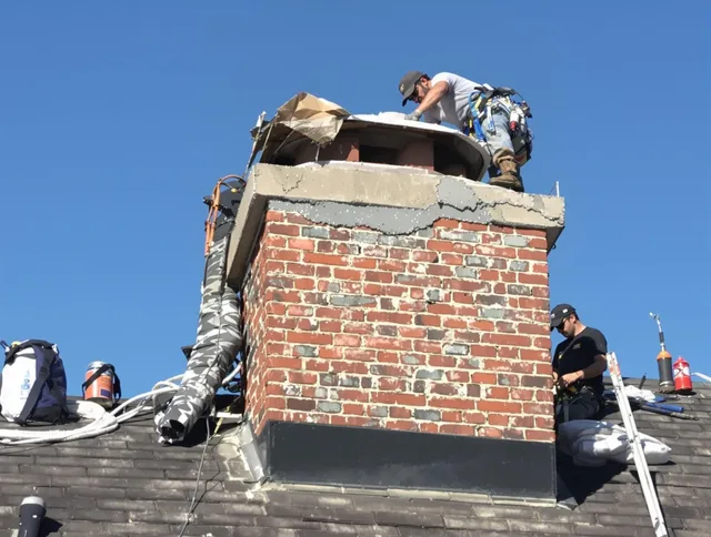 East Haven Chimney Sweep installing a custom chimney crown in East Haven, CT