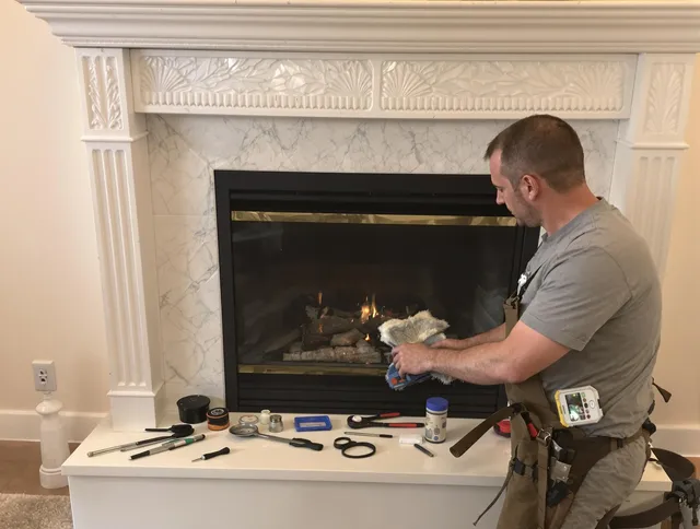East Haven Chimney Sweep performing fireplace maintenance in East Haven, CT