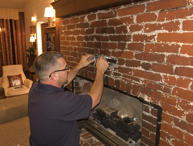 East Haven Chimney Sweep expert fixing a fireplace in East Haven, CT
